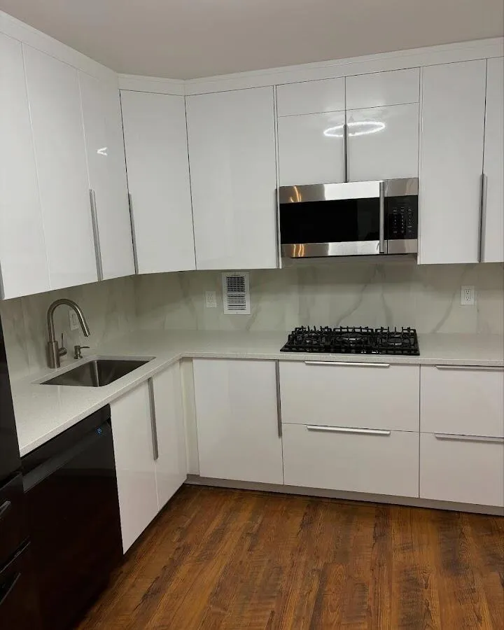 Restored kitchen with white cabinets after water damage in Aloha
